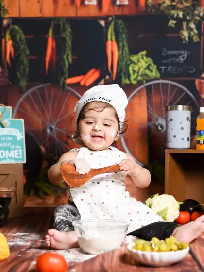 Having a blast in the kitchen! This little chef is making a happy mess, and I am here for it. These action shots show so much personality.