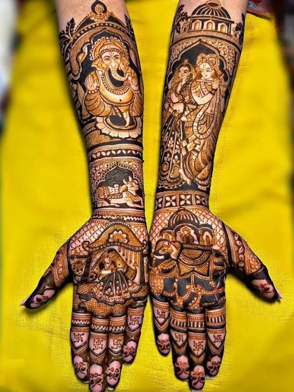 A divine and auspicious design for a new beginning. This mehendi features a large portrait of Lord Ganesha for blessings, alongside a depiction of Radha and Krishna.
