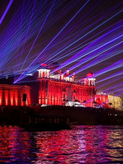 Dev Deepawali in Varanasi is a visual spectacle. This shot captures the grand laser show over the historic Ramnagar Fort, reflecting vibrant colors onto the sacred Ganga river.