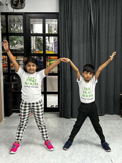 Our little dancers striking a pose in their official Beat Room t-shirts. Practice makes perfect, and these two are working hard.