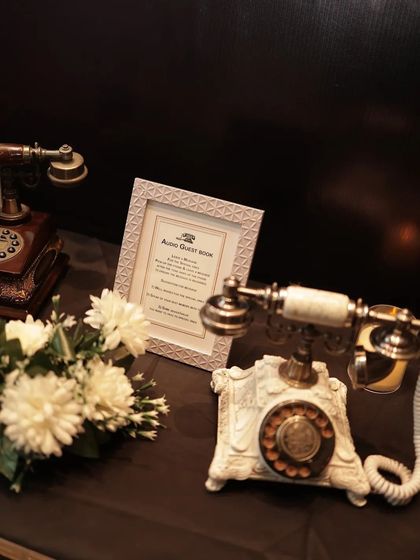 A modern twist on a classic guest book. This audio guest book station allowed guests to leave recorded messages using vintage telephones, creating a unique and lasting keepsake. It's a wonderful interactive feature for any milestone event.
