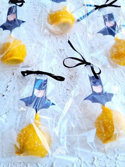 Batman-themed cakepops, individually wrapped and perfect for party favors.