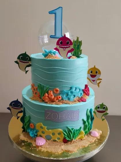 Another angle of the popular Baby Shark themed cake, showing the fun details and characters that kids adore.