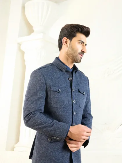 This navy blue co-ord set showcases a modern, structured silhouette. Featuring utilitarian pocket details and a sharp cut, it represents a fusion of classic tailoring with contemporary design for a polished, versatile look.