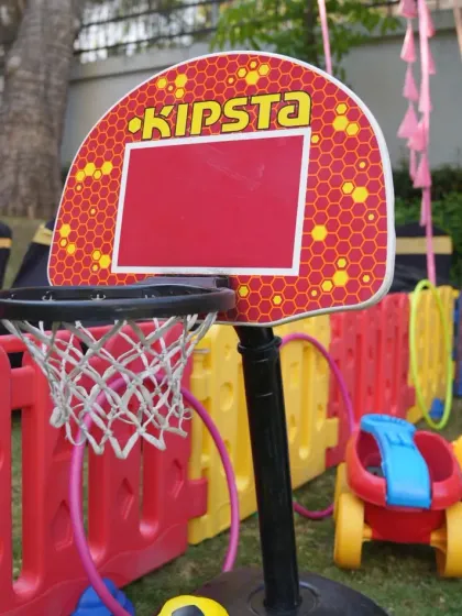 In addition to larger play structures, we provide smaller sports game rentals like this adjustable basketball hoop. It's a great way to add another layer of interactive fun to your kids' play area.