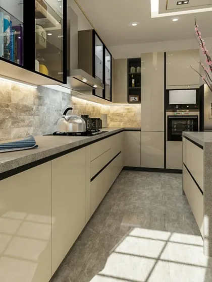 Another view of the modular kitchen, highlighting the clean lines of the countertops and the under-cabinet LED lighting. The layout is designed for an efficient workflow, with the oven and other appliances built seamlessly into the cabinetry.