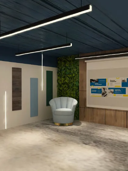 A presentation area in the office with a projector screen and a comfortable accent chair. The wall features colorful panels, adding a playful touch to the professional space.