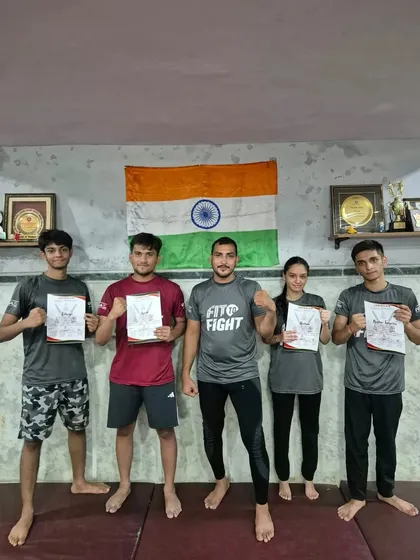 A group of our members proudly holding their camp participation certificates.