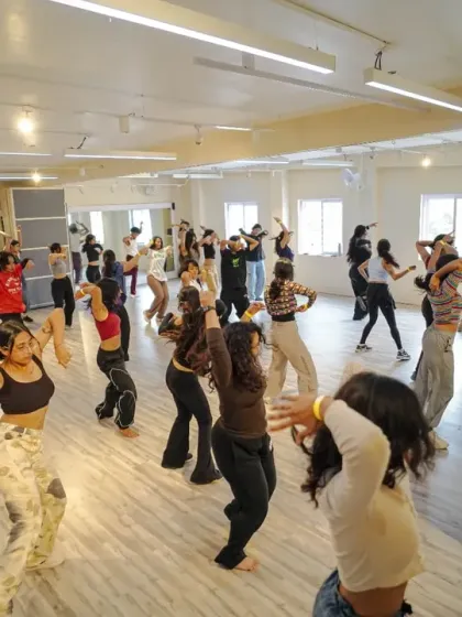 A room full of waackers. The dynamic energy of the workshop is palpable in this wide shot.