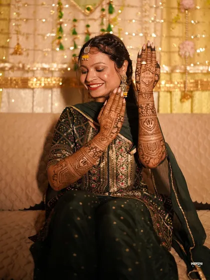 The joy on a bride's face when she shows off her finished mehendi is priceless. For me, capturing the Mehendi ceremony is about documenting the vibrant colors, the beautiful henna art, and these moments of pure, happy anticipation before the big day.