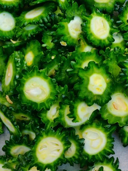 Sliced bitter gourd, ready for the pickling process. This unique pickle is a healthy and surprisingly tasty option.