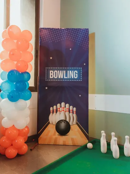 Strike! A mini bowling alley set up for a Nerf Gun-themed party. It's a fun and easy game that fits into almost any indoor party space.
