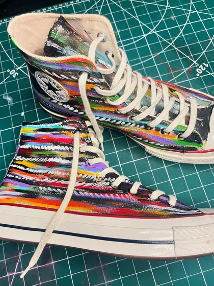 I transformed a plain white pair of Converse high-tops into this bohemian dream with abstract, colorful brushstrokes.