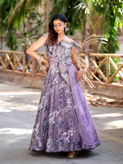 A full-length view of the gorgeous lavender gown, perfect for a modern reception.