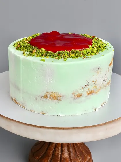 My Raspberry Pistachio Naked Cake is for those who want less fluff and more indulgence. I pair a soft pistachio sponge with a fresh raspberry compote and a pistachio white chocolate ganache. It's all about premium ingredients and balanced flavours.