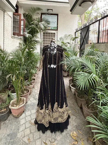 A closer look at this beauty. The gold embroidery on the black fabric creates a stunning contrast.