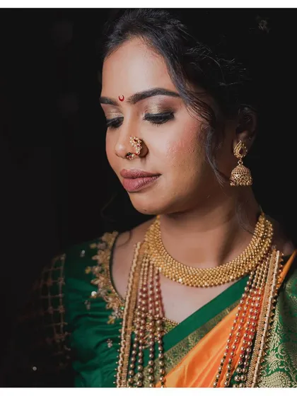A beautiful close-up showing real skin. Shweta's wedding makeup looks flawless even in this detailed shot, a testament to the skin-like finish I strive for.