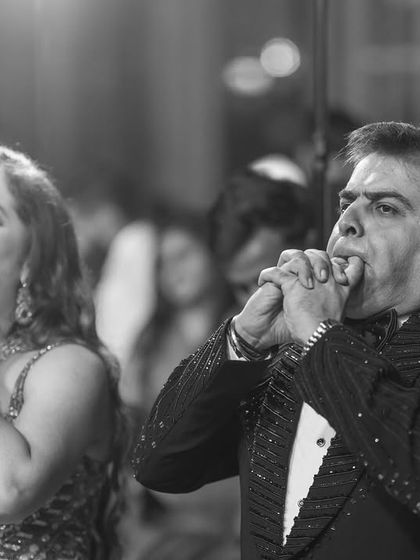 A crazy candid shot of the family cheering and whistling, completely lost in the joy of the celebration. This is the energy we live for.