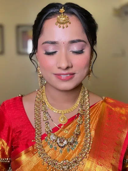 A close-up of the soft and elegant eye makeup for this South Indian bridal look. The subtle shimmer and defined lash line create a look that is both traditional and modern.