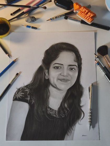 A finished portrait of a young woman, with my tools laid out to give a sense of the creative process.