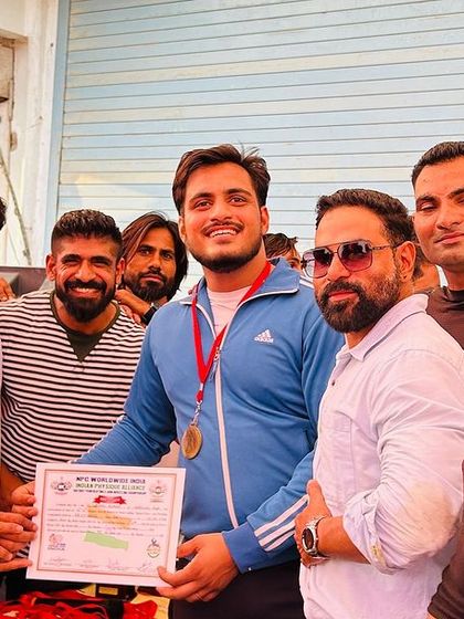 Celebrating a first-place win with my team. The support system we build is just as important as the training itself.