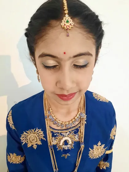 Another makeup close-up from a puberty ceremony. The focus is on clean, simple makeup with a light shimmer on the eyes to make her feel special.