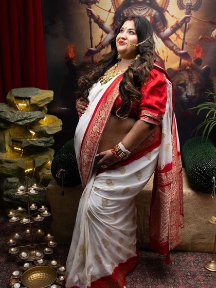 Another beautiful angle from our Durga Puja-themed maternity shoot, capturing a look of reverence and inner strength.