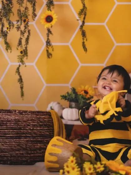 A playful moment with our little bee. The custom costume adds so much character to the photos.