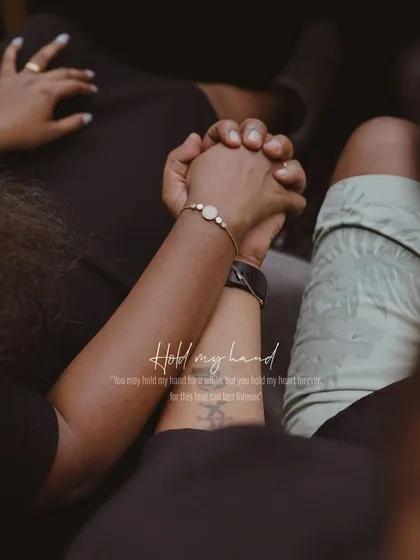A close-up of the couple holding hands, a simple and powerful image with a quote about holding each other's hearts.