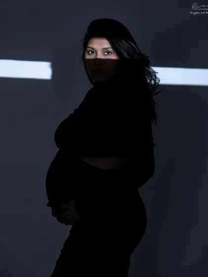 Using a projector to cast a sliver of light. This creative lighting technique creates a dramatic and mysterious silhouette that is truly one of a kind.