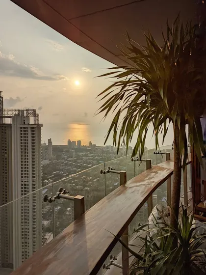 A simple bar top and a well-placed palm can completely change your balcony experience. We designed this space to be the perfect spot for enjoying a sunset over the Mumbai skyline.