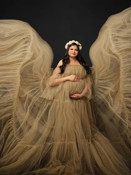 There is something truly angelic about creating life. Using a beautiful tulle gown to create ethereal wings, we celebrate the miracle you are carrying with this fine art maternity portrait.