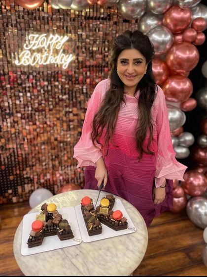 The wonderful Archana Kochhar celebrating her birthday with the custom 'A' and 'K' monogram cakes I created for her.
