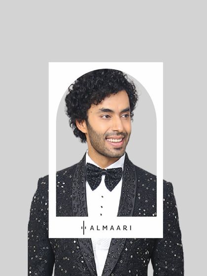 A happy client ready for his big event in one of our sparkling tuxedo jackets. The sequined bow tie completes this fun and formal look, perfect for a reception or New Year's Eve party.