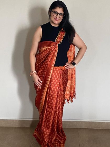 A full view of my contemporary saree look. Draping a traditional saree over a black high-neck top gives it a chic, modern edge while maintaining its inherent elegance.