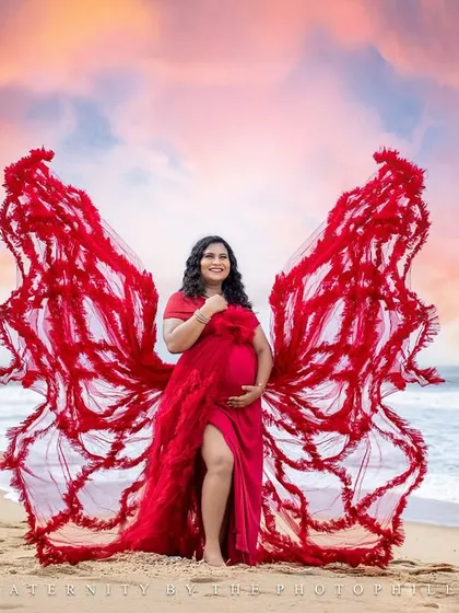 This is the art of motherhood. We love creating these breathtaking moments with our signature butterfly gowns against the dramatic skies of the Kerala and Chennai coastlines, turning your maternity portrait into a masterpiece.