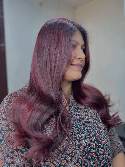 A side view of the cherry blossom red, showing how the color complements her skin tone and personal style.