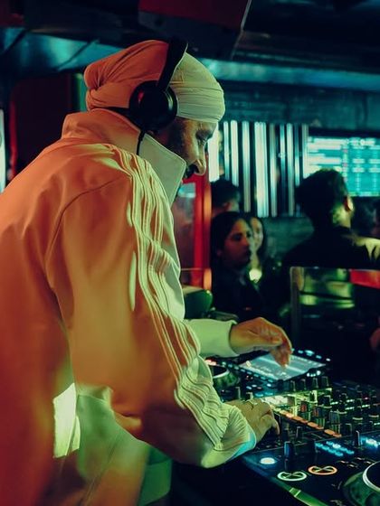 In the zone, mixing tracks under the red lights at Tipsy Bull.