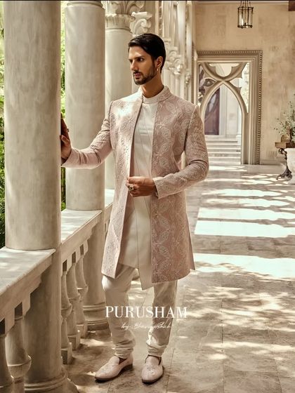 A full view of the dusty rose sherwani, showing how it pairs with ivory churidars and matching embroidered shoes. I believe in creating a complete, head-to-toe look that feels intentional and perfectly composed.