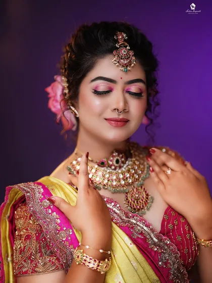 A close-up of this vibrant pink eyeshadow look. I pay close attention to detail, ensuring the eye makeup is blended perfectly and complements the entire look, from the jewelry to the outfit.