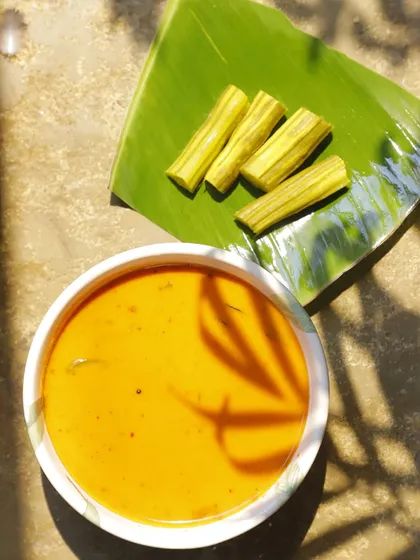 This is my Muringakka Manga Ozhichukootan, a beautiful drumstick and raw mango curry. The sharp tang of mango, earthy depth of drumsticks, and creamy coconut base create a comforting dish that is guided by instinct and memory, not just a recipe.