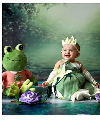 Your little one's fairytale starts here. For this newborn photoshoot, we created a custom Princess Tiana inspired outfit, complete with a lily pad petal skirt, delicate arm bands, and a tiny crown. It’s a perfect way to celebrate the arrival of your own little princess.