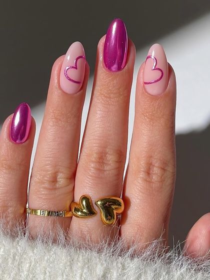 These Valentine's nails are all about that vibrant chrome finish. We used a stunning metallic magenta polish and added cute heart outlines for a look that's both bold and romantic.