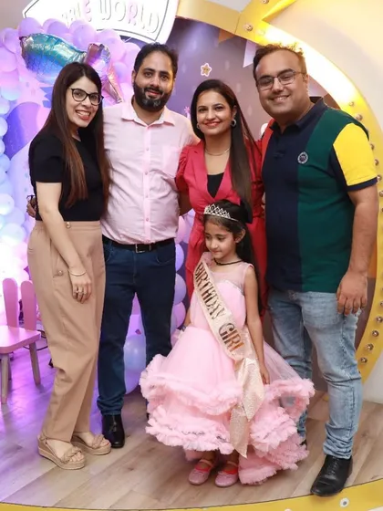 The birthday girl, her family, and friends pose for a photo. We love being a part of these milestone celebrations.