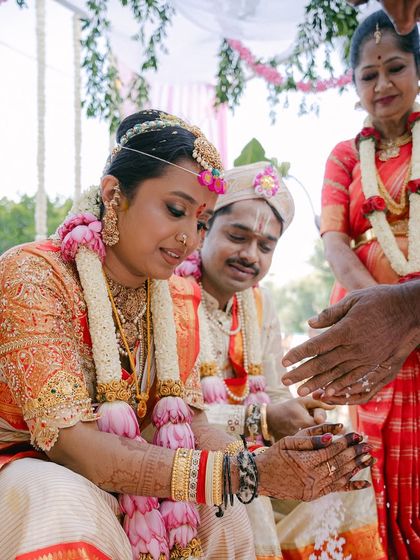 A close-up of a traditional ritual during the South Indian wedding ceremony. Capturing these details is essential to telling the couple's complete story.
