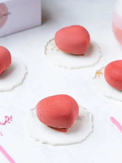 Heart-shaped petit gateaux with a soft, velvety texture. We use lighting to emphasize unique textures and finishes on gourmet desserts.