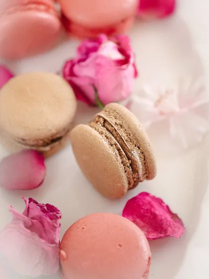 A close-up of the macarons, playing with focus to draw the eye to the texture and detail of a single cookie.