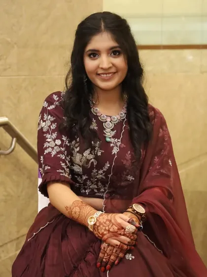 A beautiful seated portrait of the bride on her engagement day. The soft glam makeup and hair look was perfect for her elegant style.