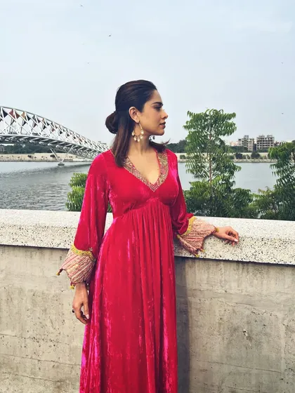 A pop of pink for Nushrratt Bharuccha in Ahmedabad. This velvet maxi dress with embellished cuffs is a comfortable yet glamorous choice for travel and promotional events.