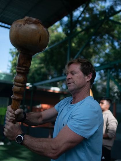 A diverse group of members, including international participants, train with Gadas and Mudgars. This shows the universal appeal of our workout, bringing people from all backgrounds together.